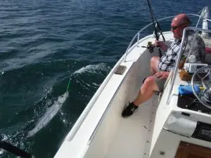 Charter guest battling barracuda during exciting Lower Keys fishing adventure